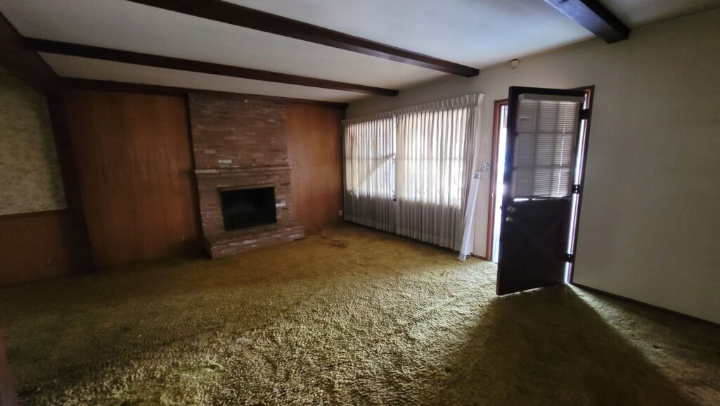 Greenbush Sherman Oaks before - original living room with fireplace